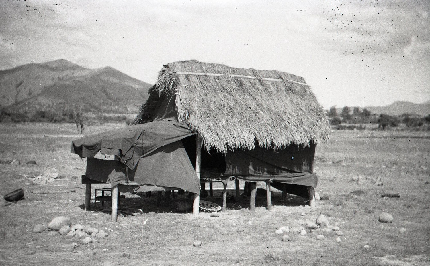 Thatched Shelter with Military Canvas Siding, Rural Luzon, Philippines, WWII Era