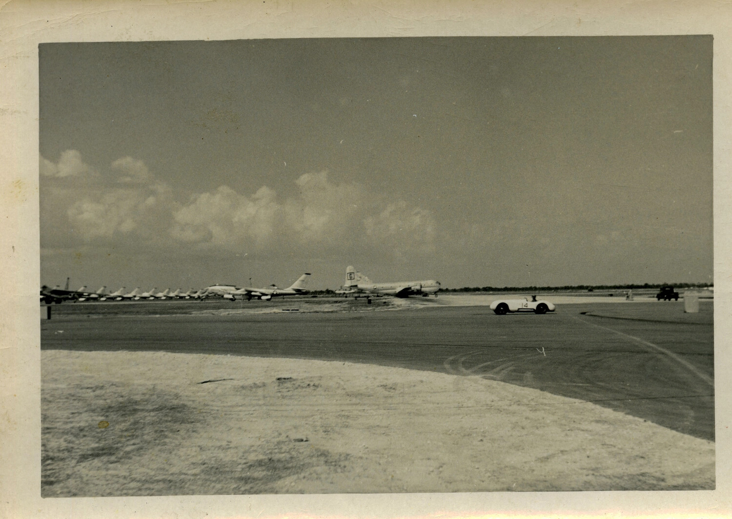 Flight Line at Hickam Air Force Base with B-47 Bombers, KC-97 Tanker, and Sports Car on Ramp, 1950s