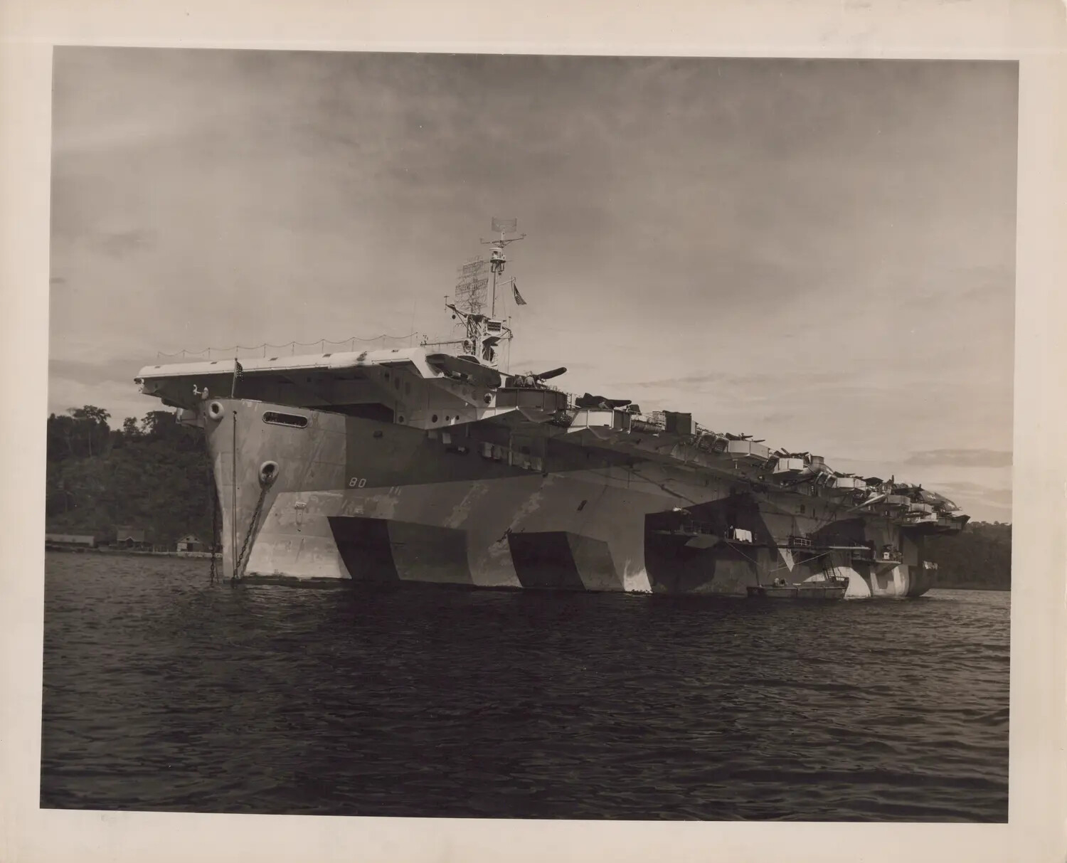 USS Petrof Bay (CVE-80) at Anchor, Bow View Showing Camouflage Scheme