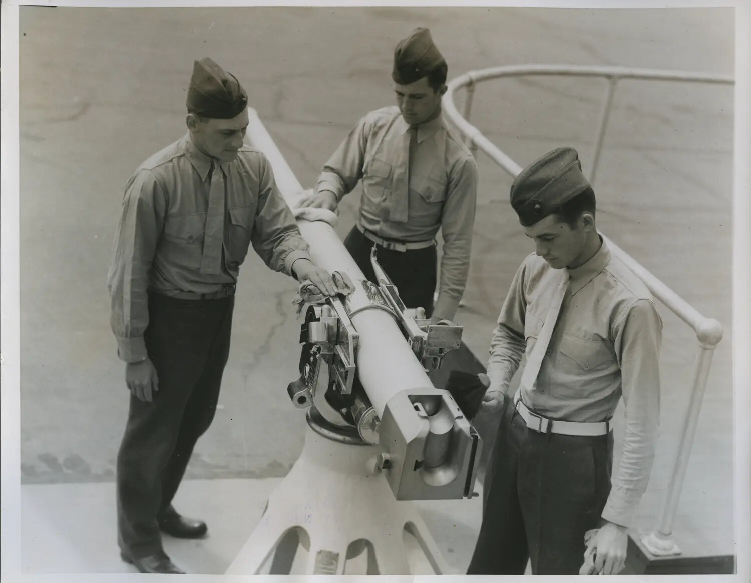 Airmen Examining an Optical Sighting Instrument on Pedestal Mount