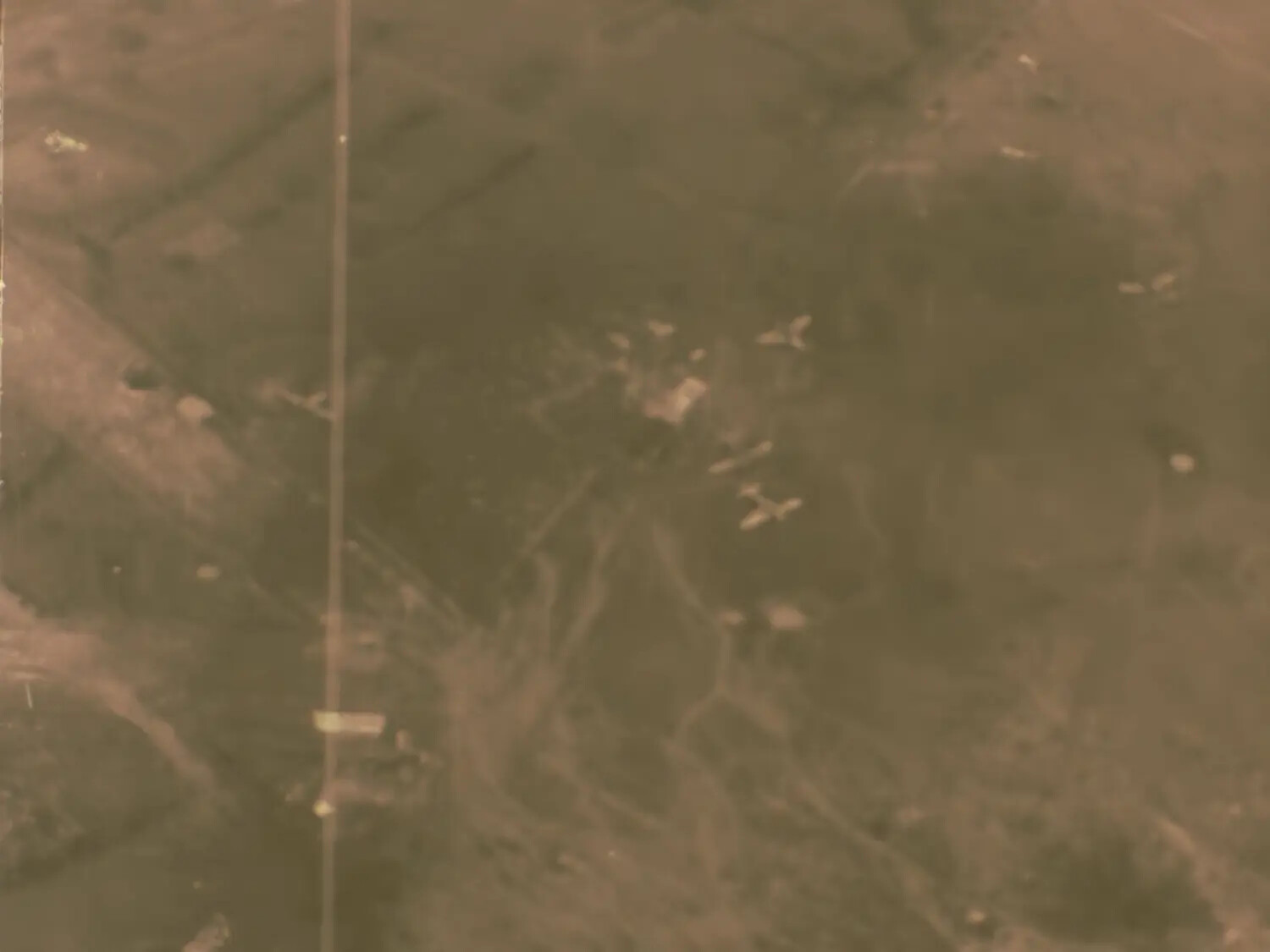 Aerial Combat Film Frame Showing Aircraft in Flight Over Terrain, Francis R. Ferry Collection