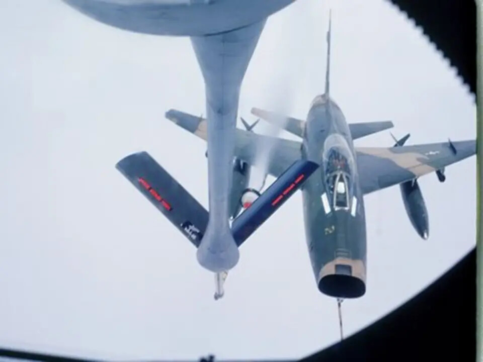 Aerial Refueling of Camouflaged Jet Fighter via KC-135 Boom, Boom Operator's View