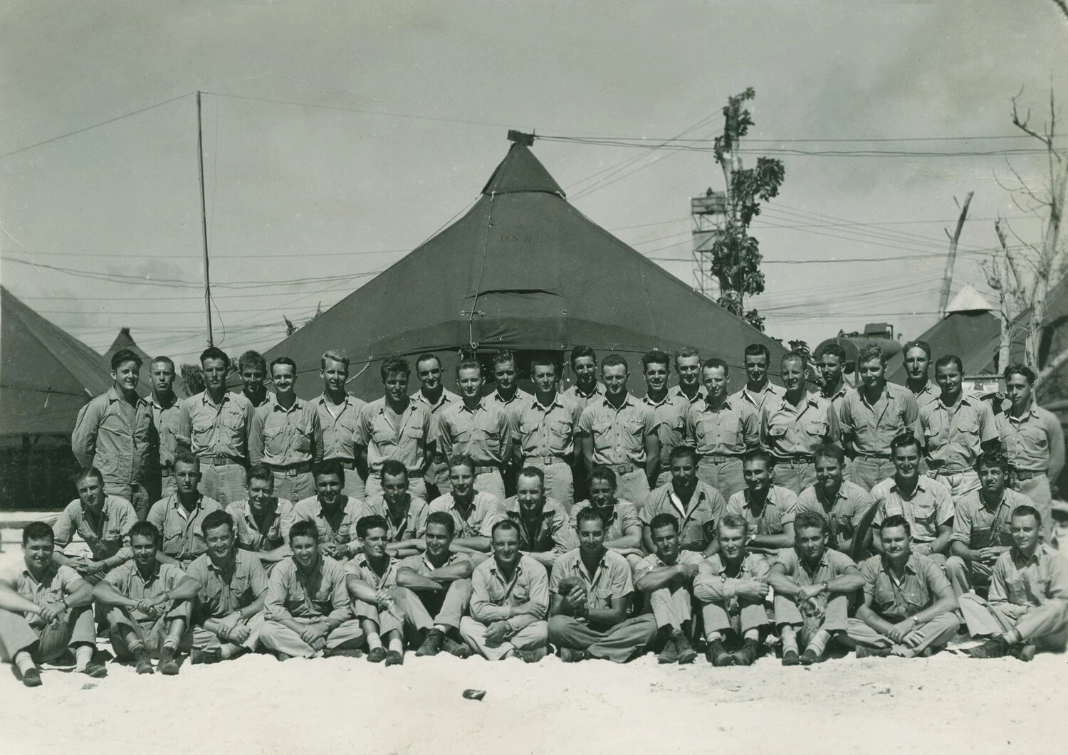 Group Portrait of Naval/Marine Unit Personnel, Pacific Island Base Camp — McAleer Collection, WWII