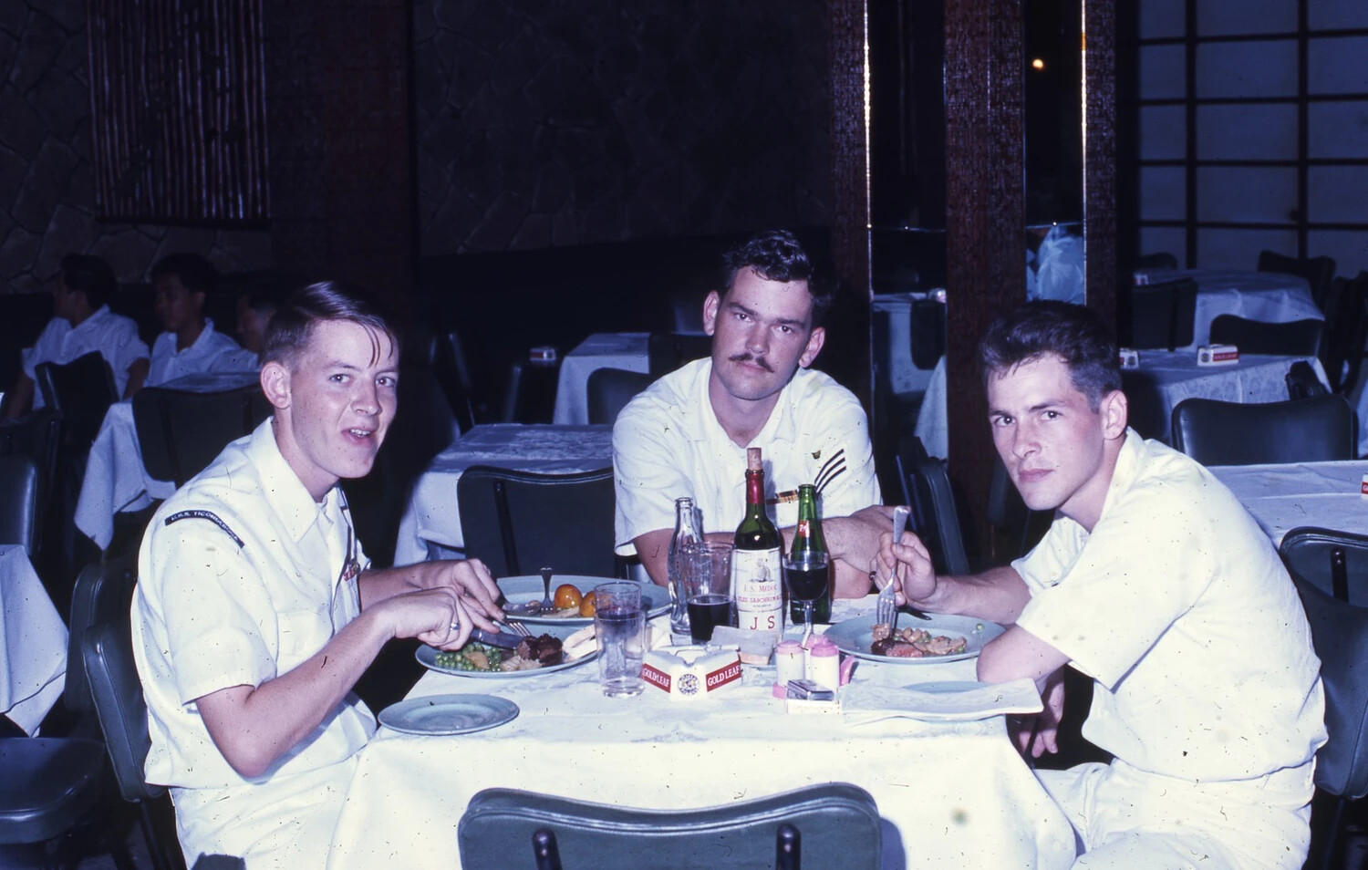 Three Sailors Dining at Restaurant During Liberty, USS Ticonderoga Collection