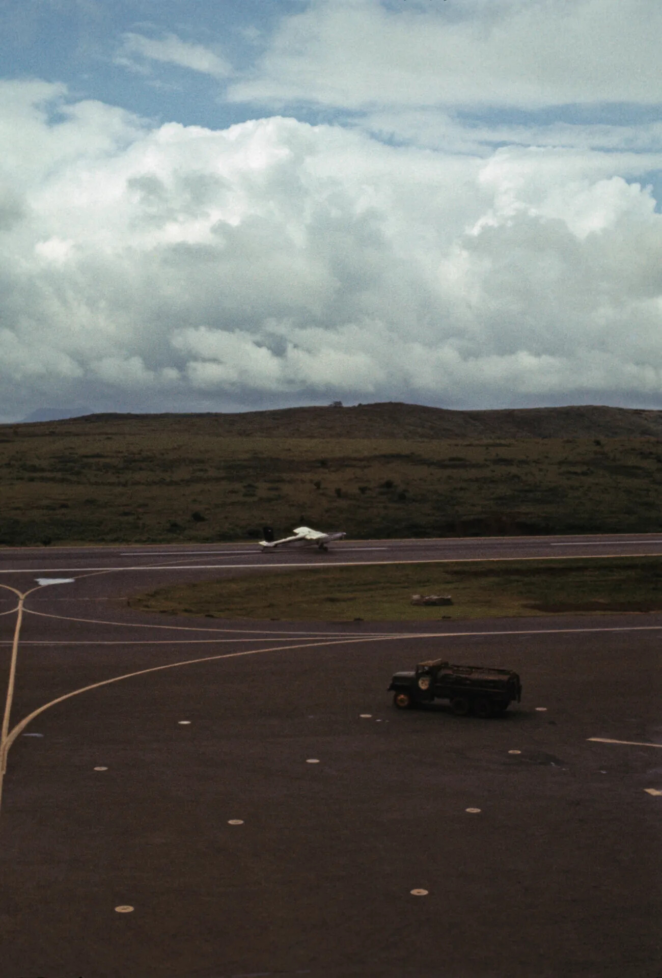 Light Aircraft on Runway with Fuel Truck on Apron, Airfield Scene (Don Engebretsen Slide Collection, c. 1969)