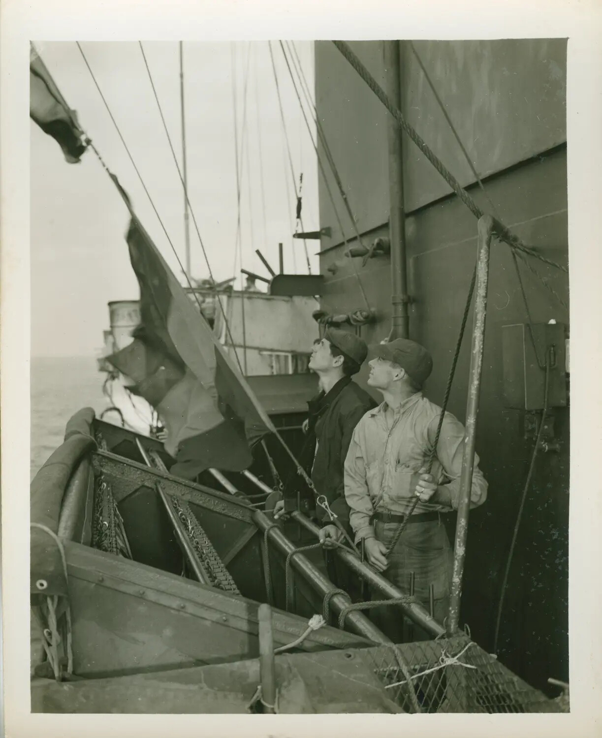 Signalmen Hoisting Signal Flags Aboard USS Petrof Bay (CVE-80), WWII