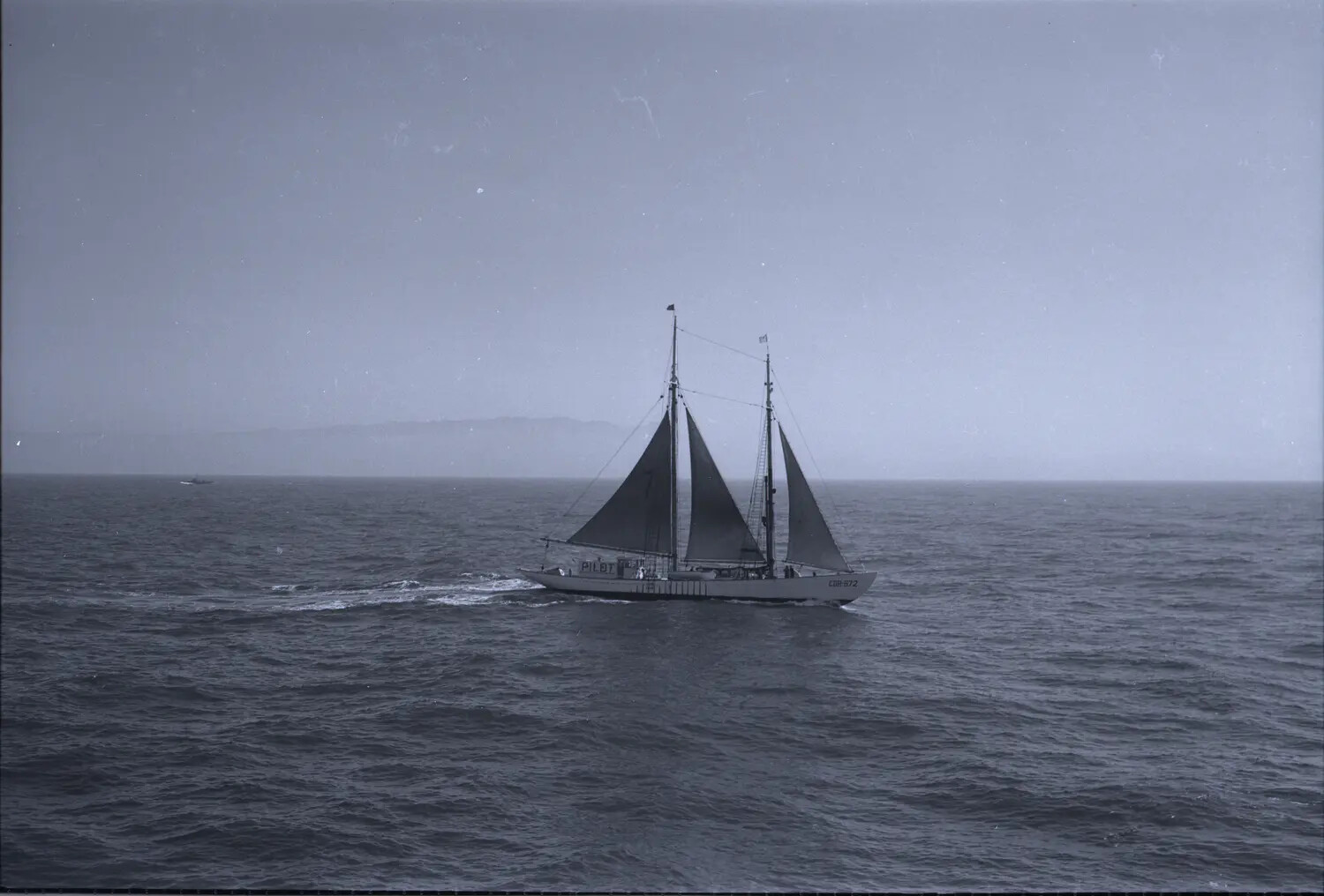 Two-Masted Pilot Schooner Under Sail, Seen from USS Petrof Bay, WWII