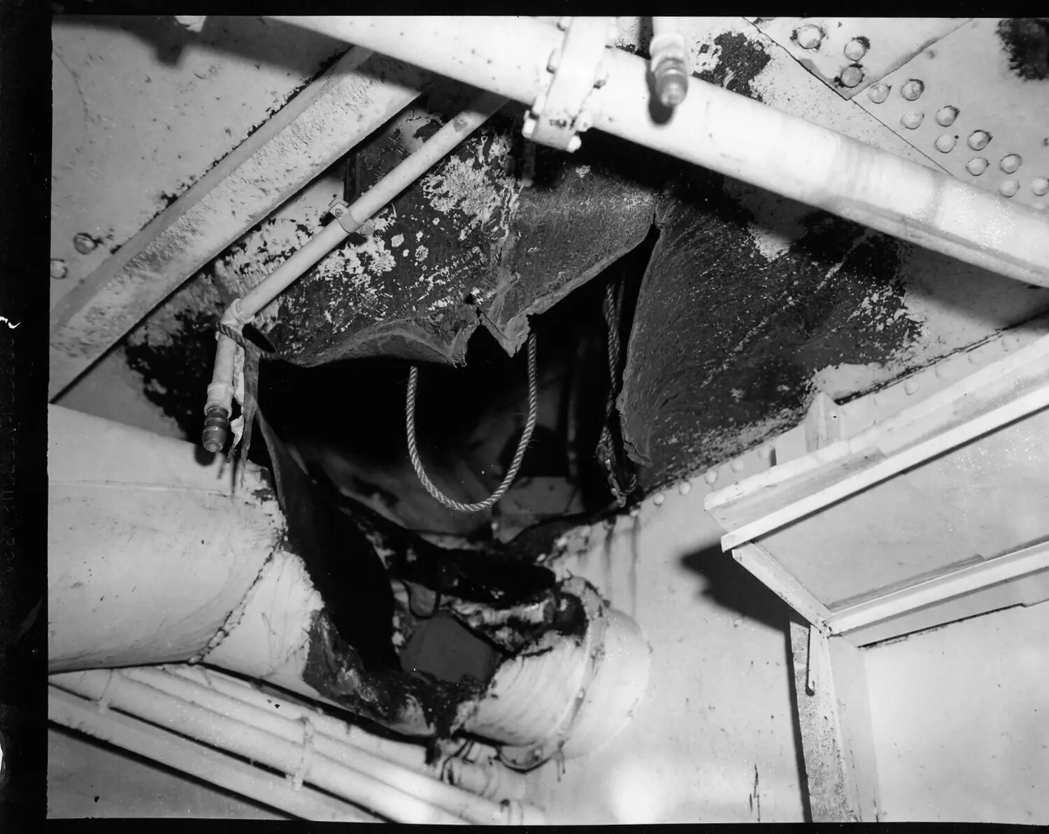 Fire-Damaged Overhead Piping and Insulation, Ship Interior