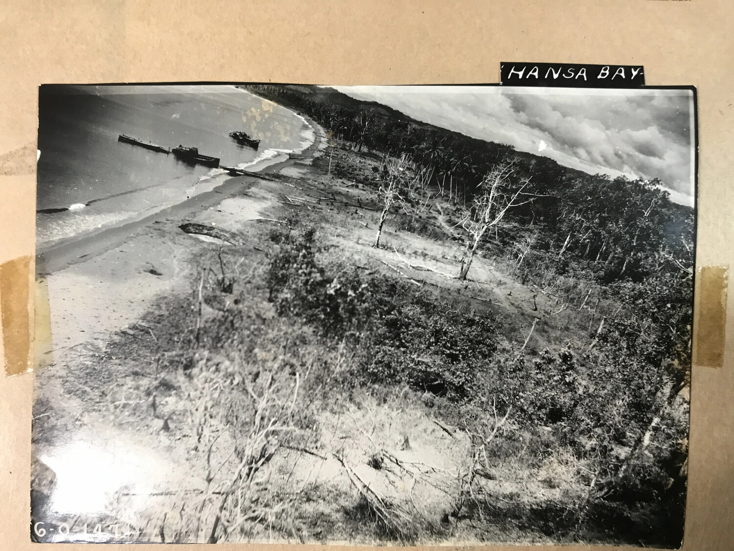 Beach, Pier, and Wrecked Vessel Amid Bomb-Damaged Coastal Vegetation, Hansa Bay, New Guinea (Print No. 6-0-147)