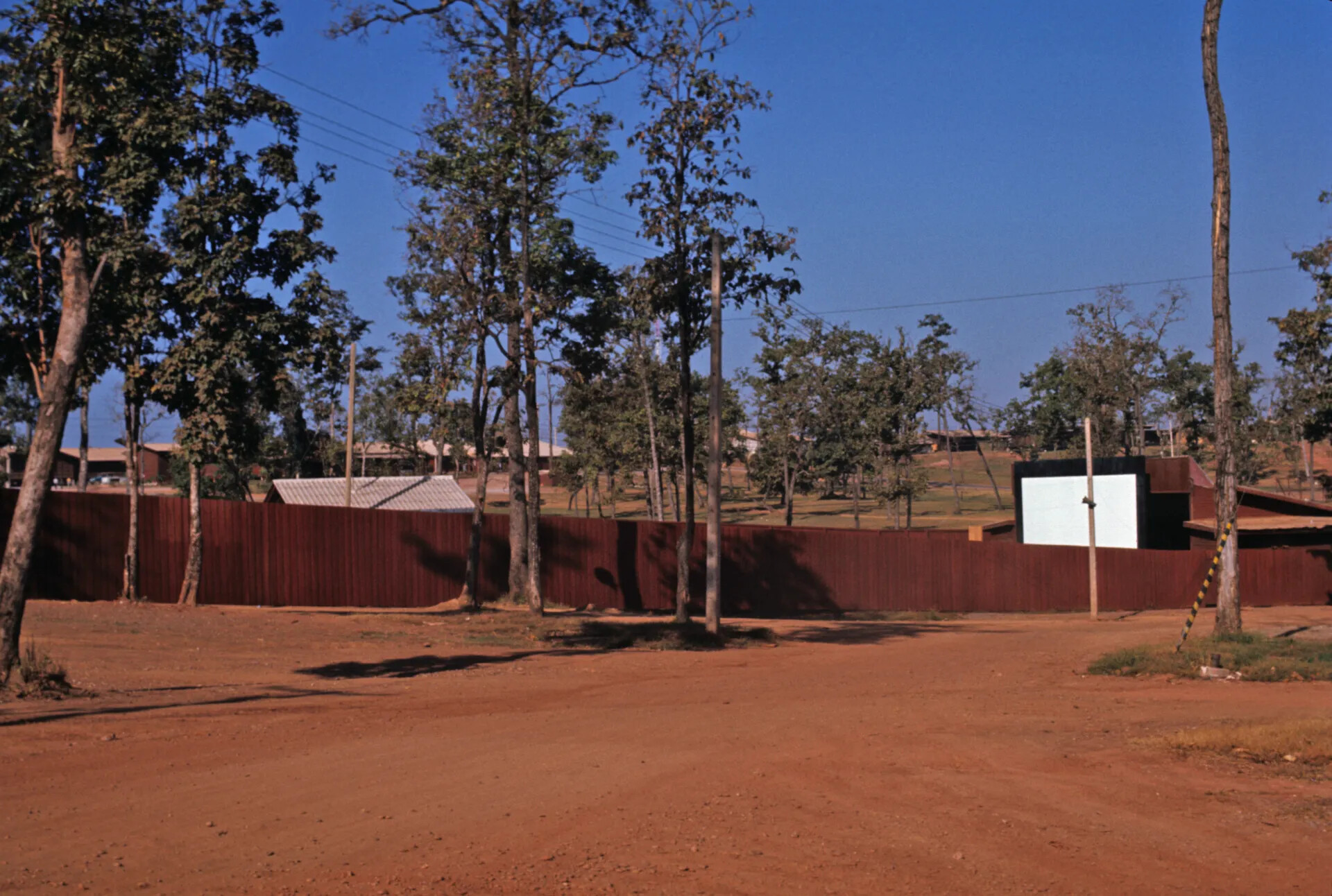 Outdoor Movie Screen and Perimeter Fence, U.S. Base, Central Highlands, Southeast Asia, circa December 1969