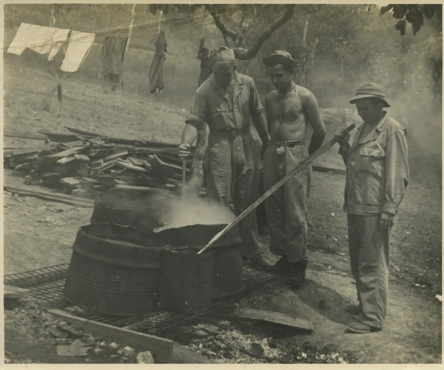 Servicemen Tending Improvised Boiling Vat at 312th Bomb Group Base, Pacific Theater