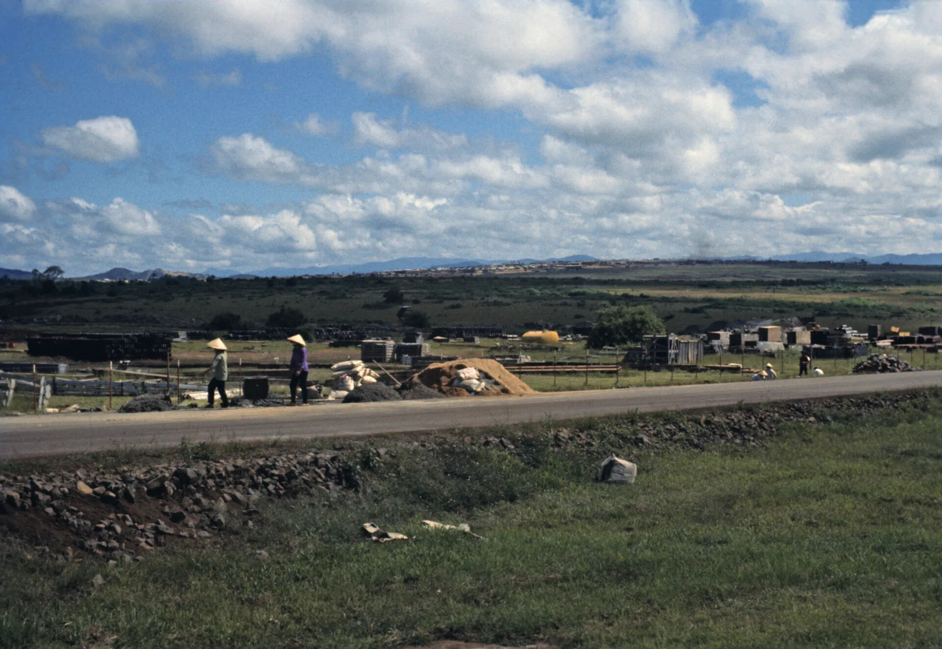 Vietnamese Laborers and Construction Materials Along Base Perimeter Road