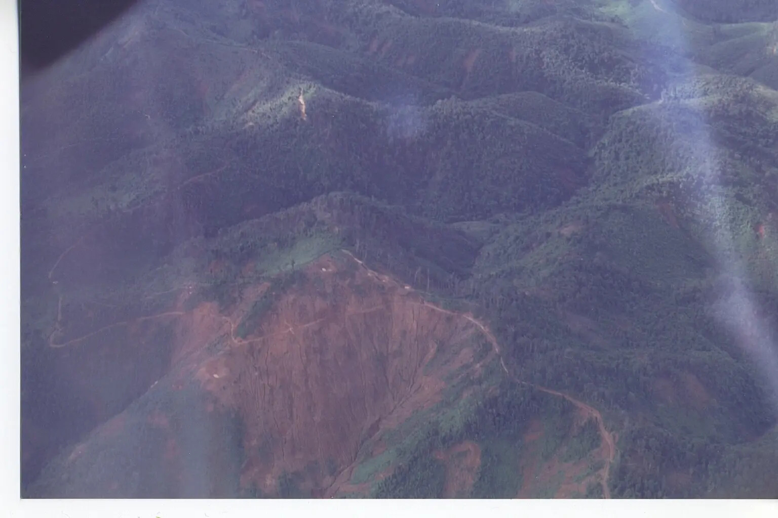 Aerial View of Mountainous Terrain and Cleared Hillside, 6th SOS Collection