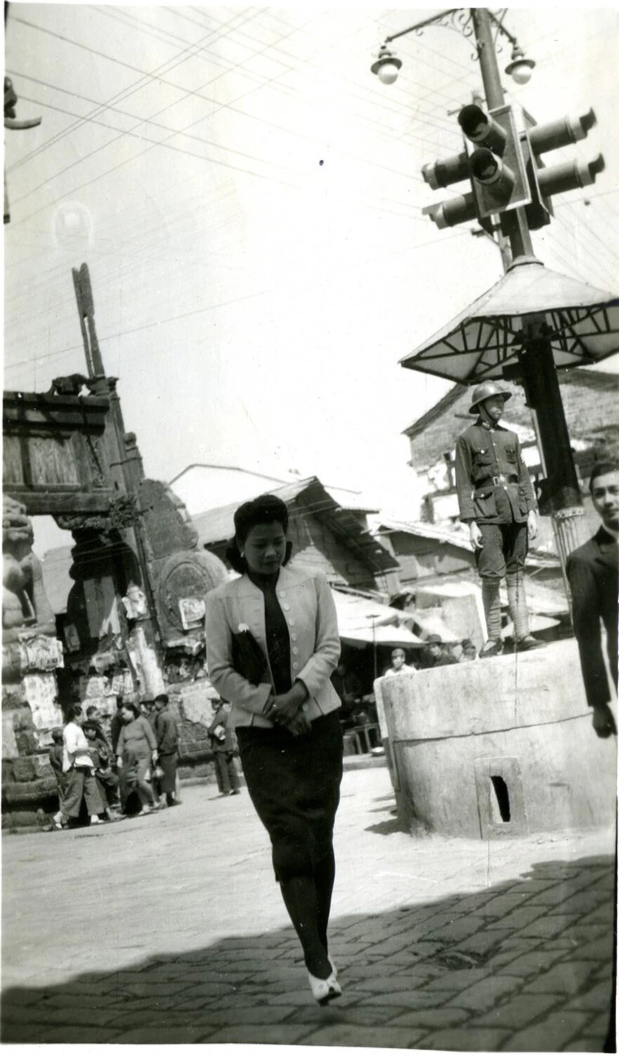 Traffic Policeman and Pedestrian at City Intersection, Burma/CBI Theater Collection