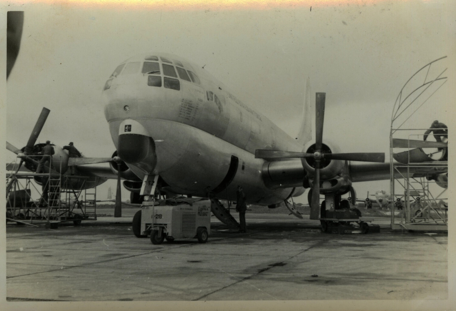 Boeing B-29/B-50 Superfortress Bomber Undergoing Engine Maintenance on Overseas Airfield Ramp