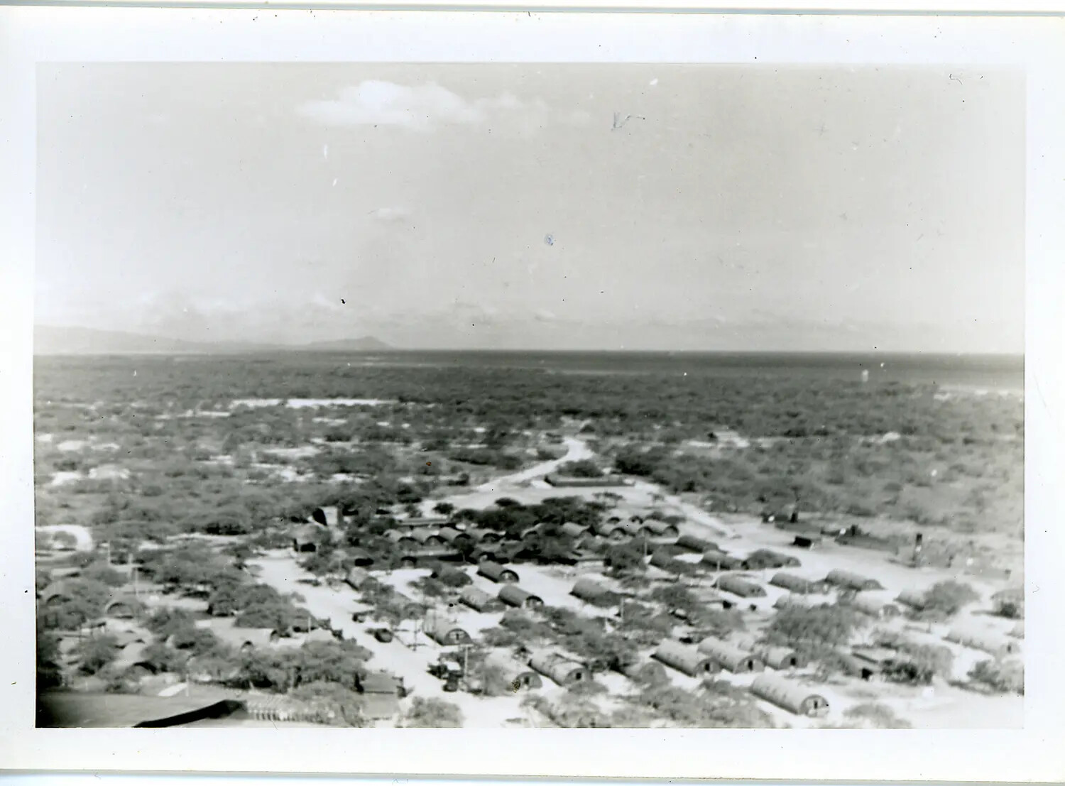 Aerial View of a WWII-Era Quonset Hut Military Encampment, Likely Oahu, Hawaii
