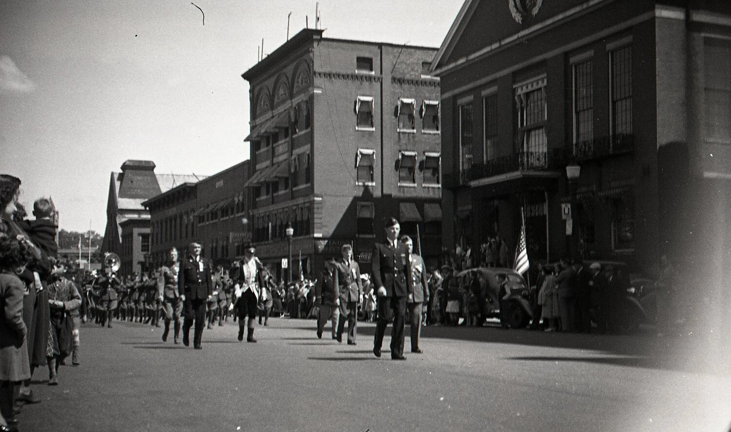 Uniformed Officers and Band Marching Past Municipal Building, Boston Parade, c. 1940s