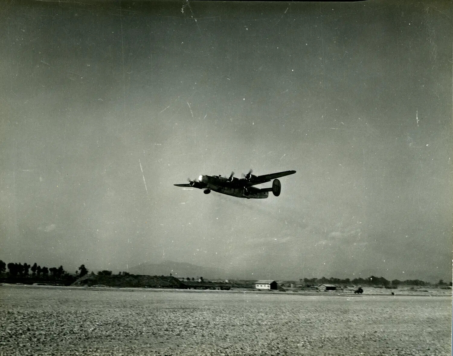 Consolidated B-24 Liberator Bomber on Takeoff, CBI Theater Airfield, World War II
