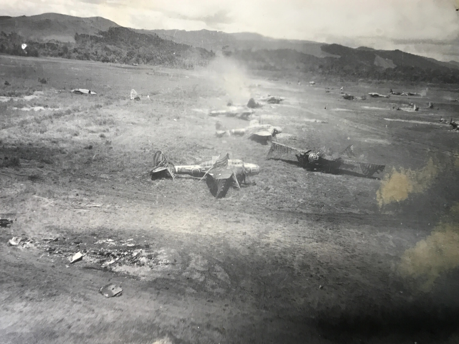 Destroyed Japanese Aircraft Littering Airfield After Strafing Attack