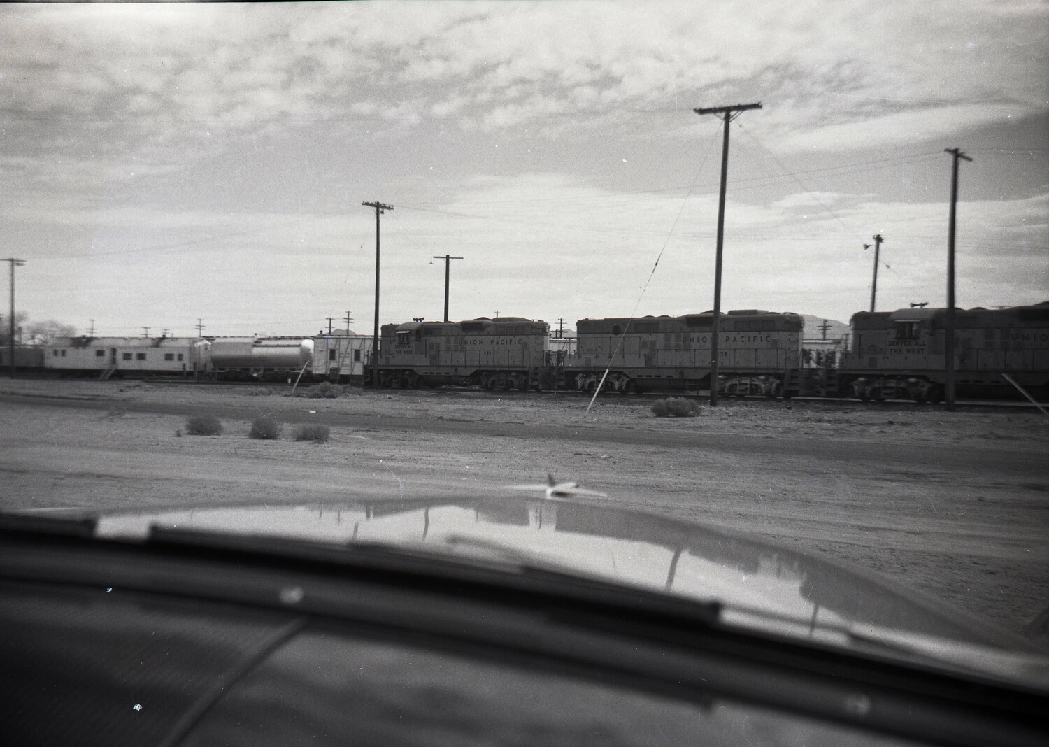Union Pacific Diesel Locomotives in Desert Rail Yard, Photographed from Automobile, American West