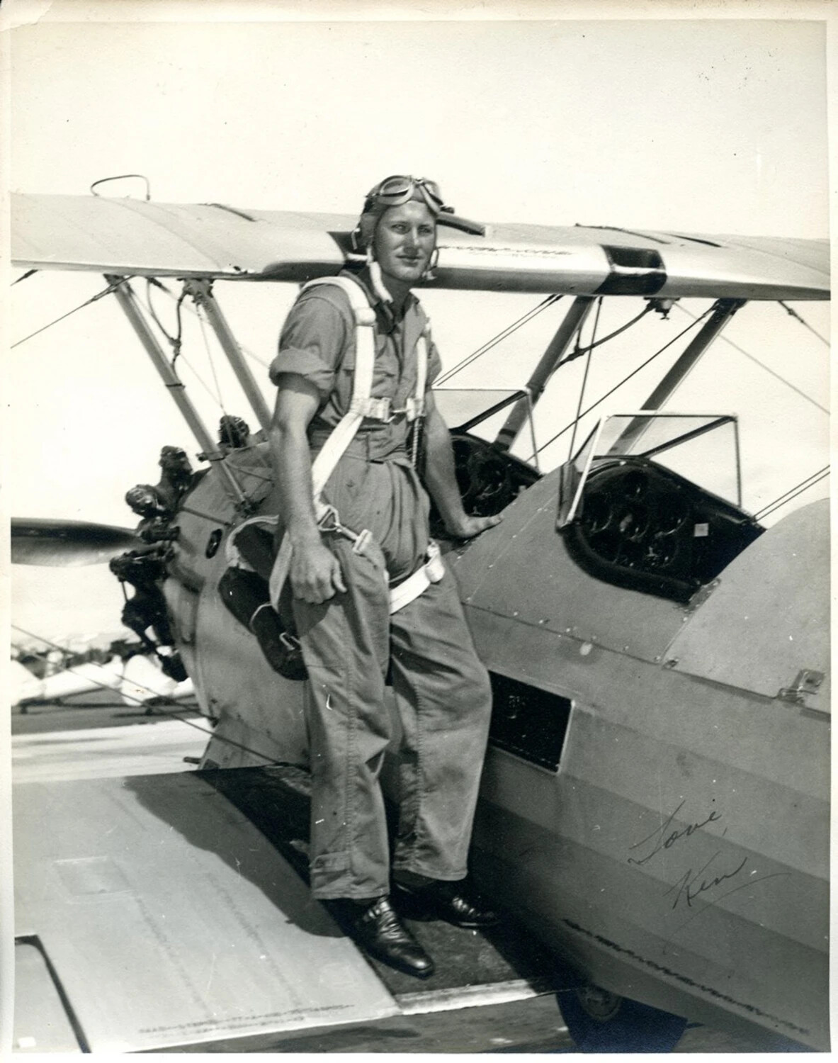 Aviation Cadet Posing on a Biplane Trainer, World War II Era