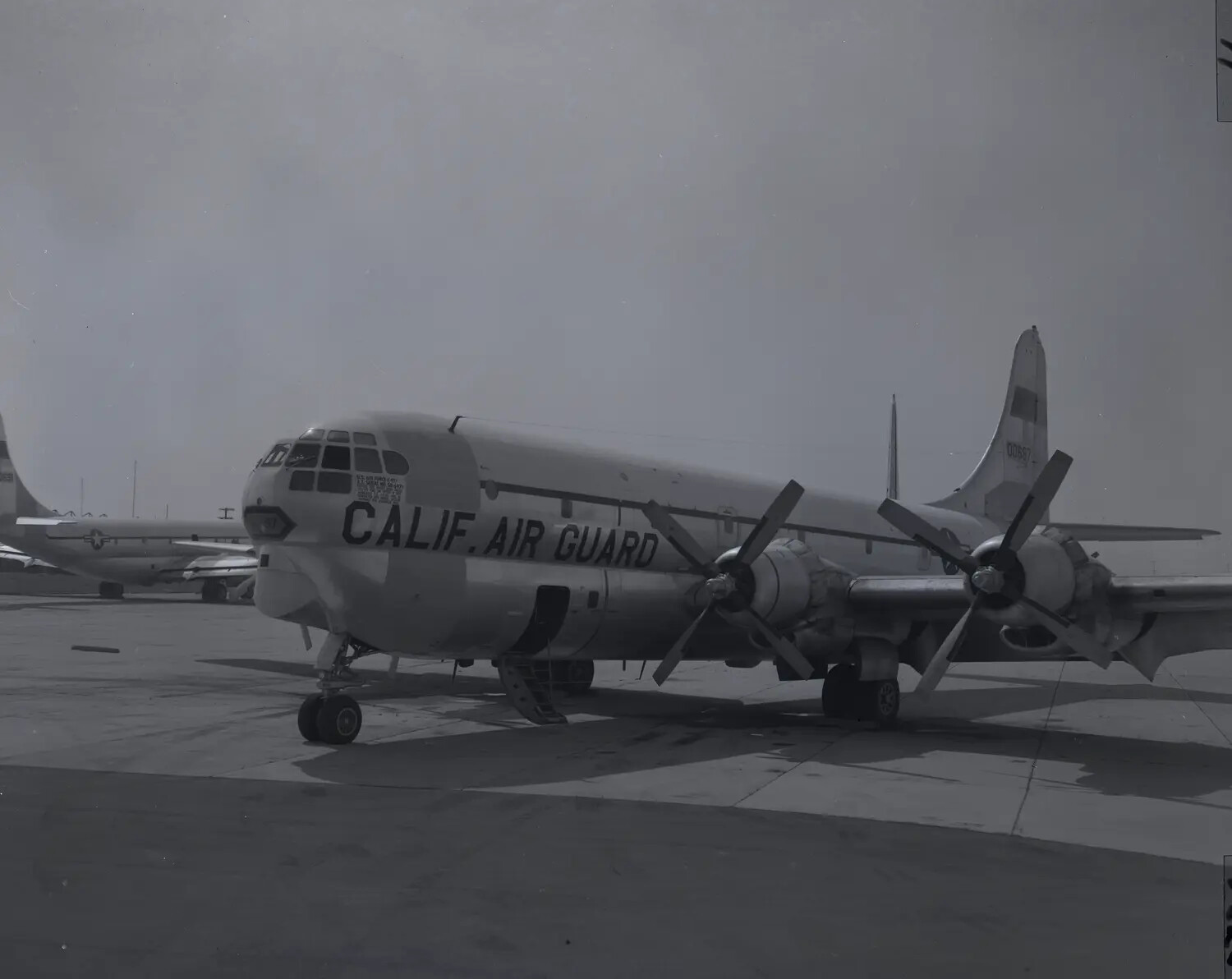 Boeing C-97 Stratofreighter, 'CALIF. AIR GUARD,' Parked on Airfield Ramp, April 1960