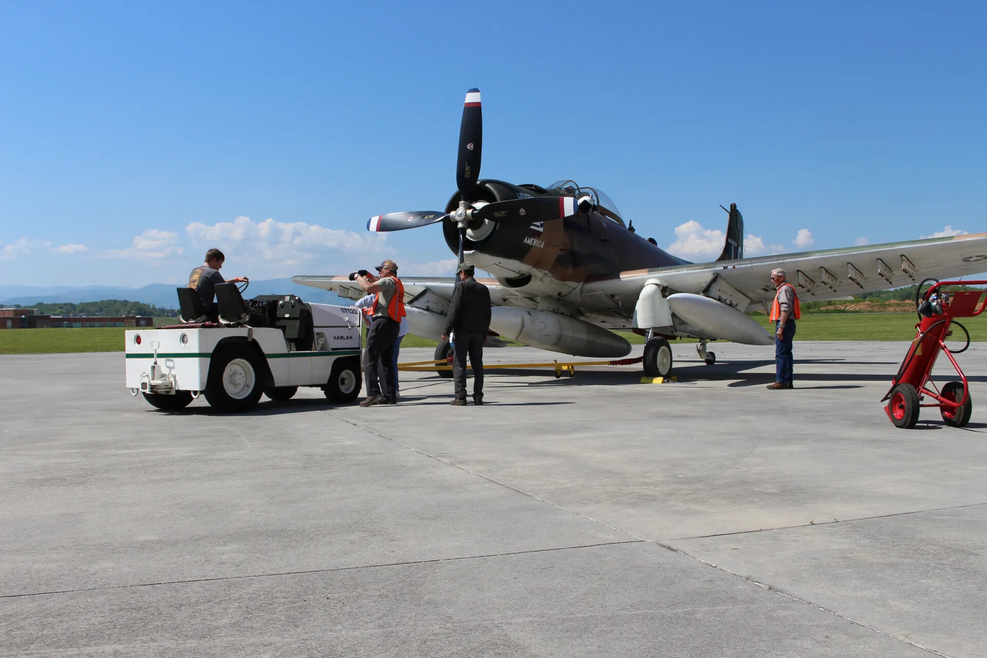 Ground Crew Towing A-1 Skyraider 'Lieutenant America' on Airshow Ramp