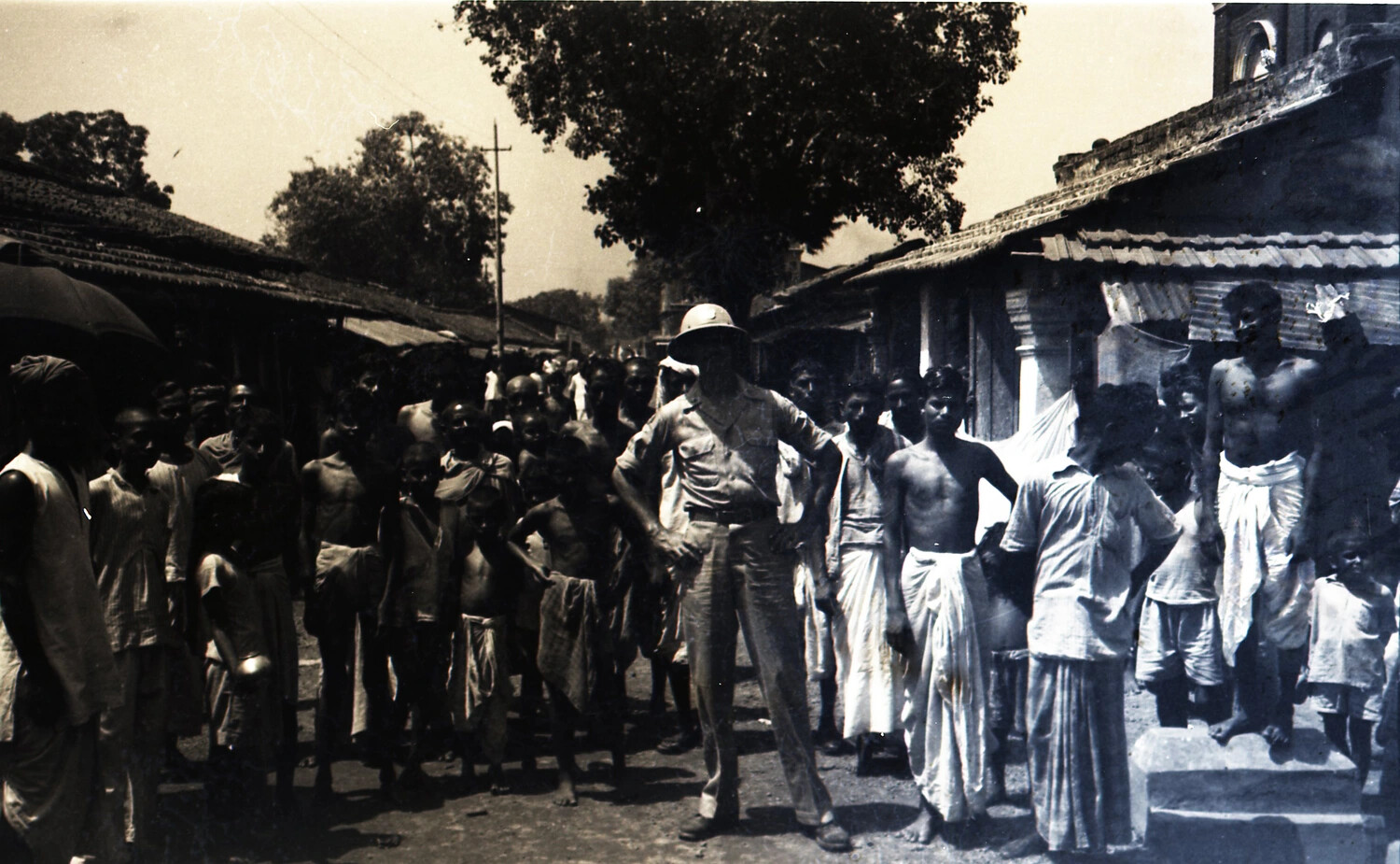 American Serviceman Among Local Villagers, India, CBI Theater, WWII