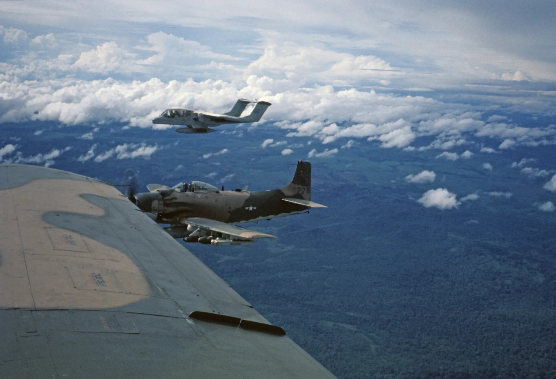 A-1 Skyraider and OV-10 Bronco in Formation over Southeast Asia, Vietnam War