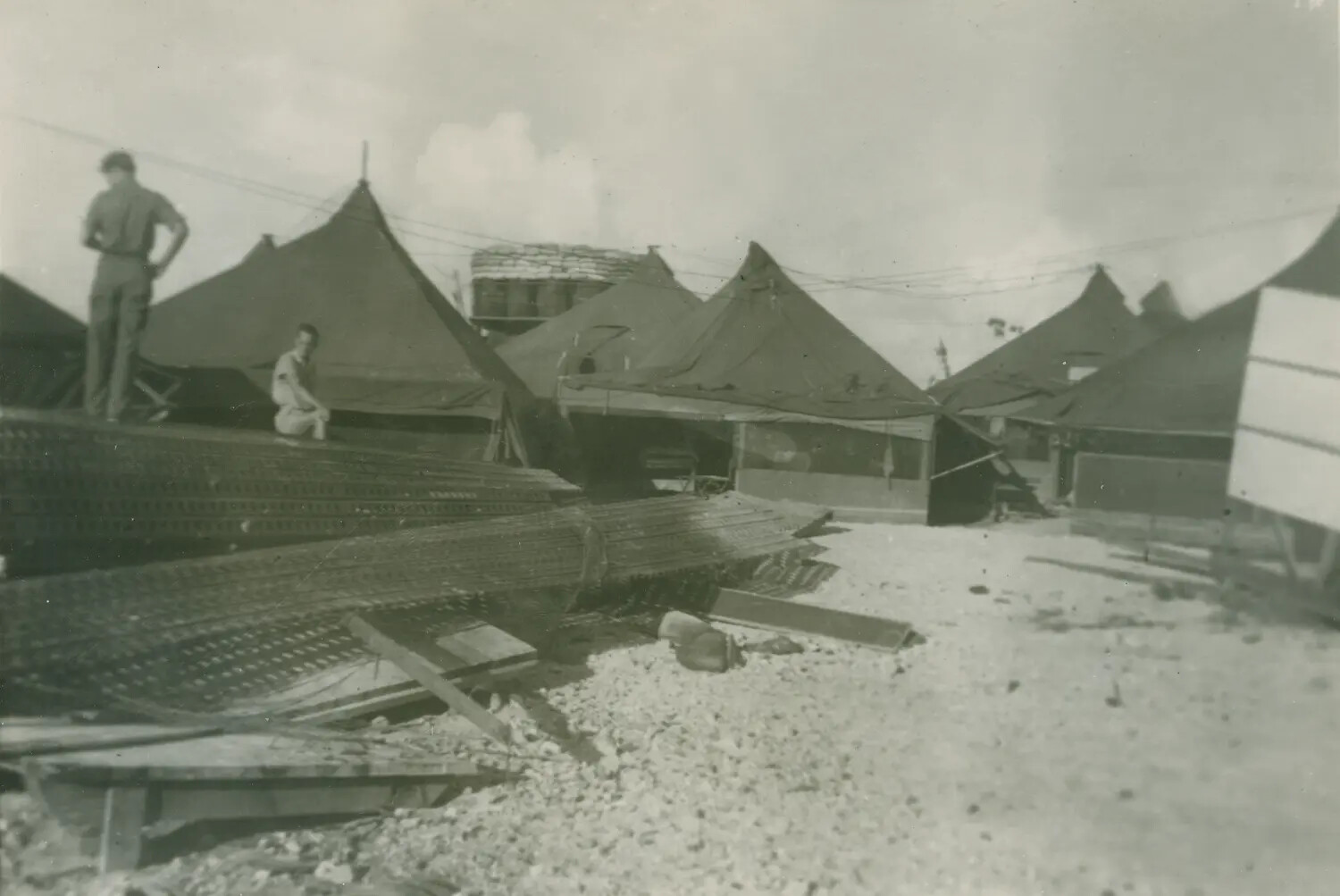Servicemen Atop Stacked Perforated Steel Planking (Marston Mat) at Pacific Tent Camp