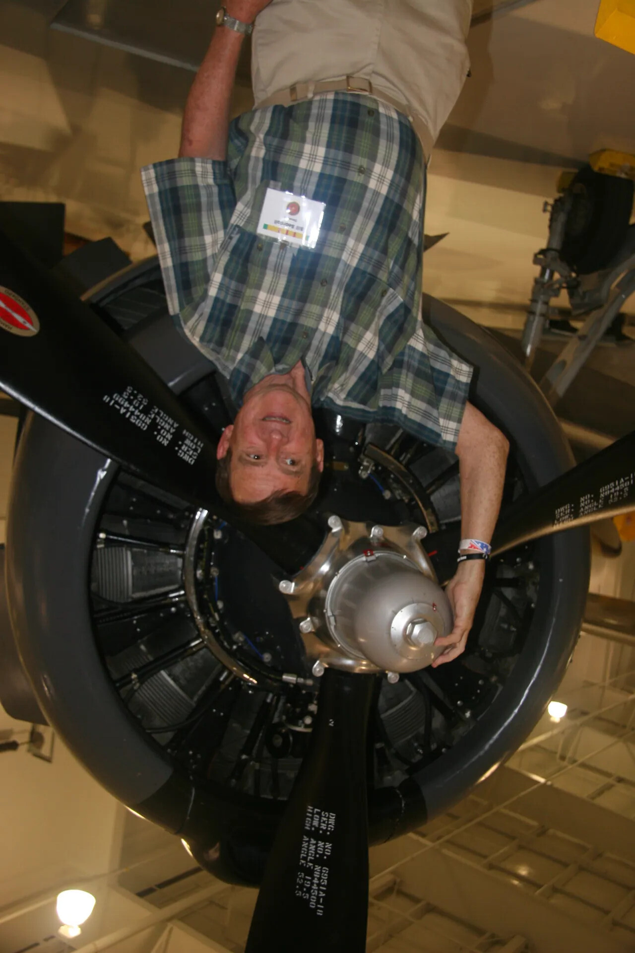 Museum Visitor Posing with Radial Engine Propeller Assembly, Aviation Museum