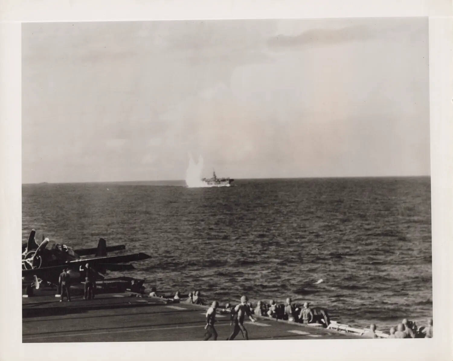 Escort Carrier Deck Crew Witness Explosion Aboard Distant Sister Ship, October 25, 1944