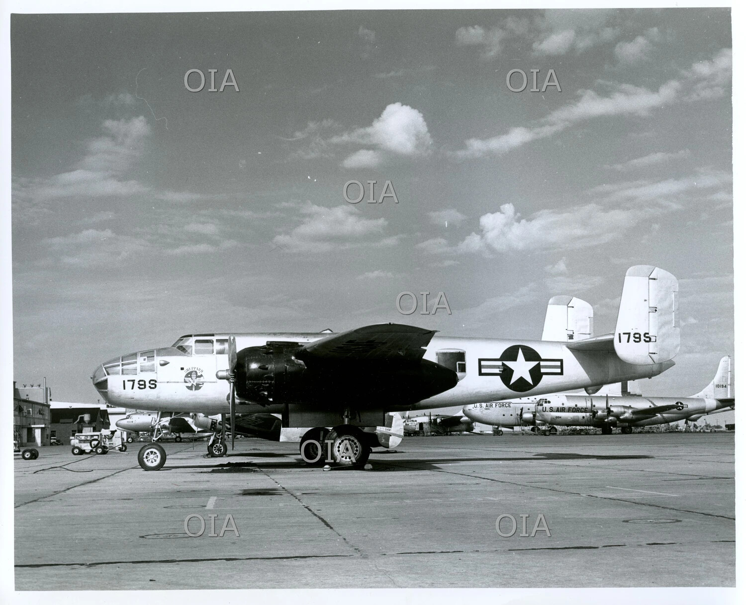 North American B-25 Mitchell (Tail No. 179S) 'Sheppard' on Flight Line with C-124 Globemaster II in Background