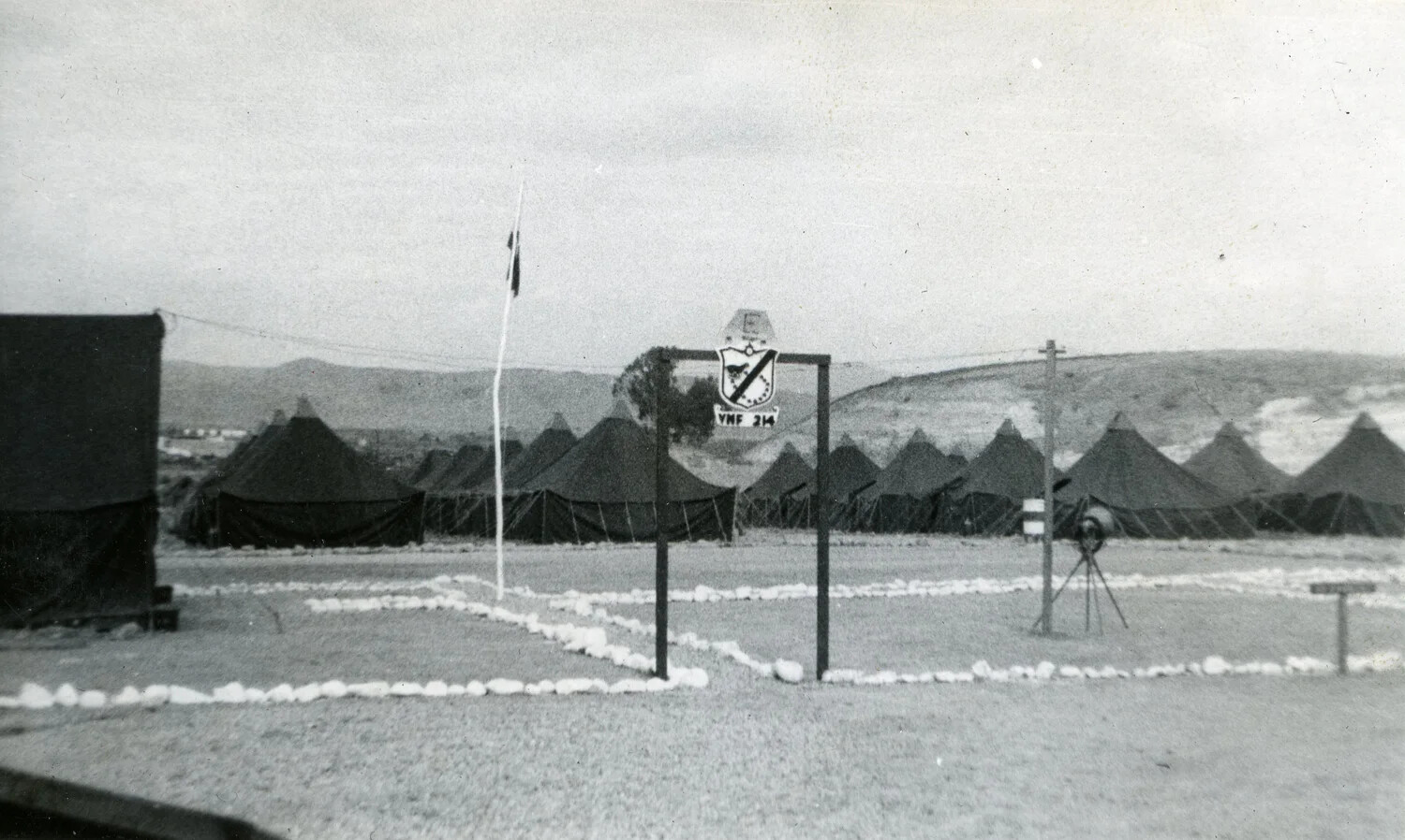 VMF-214 Squadron Camp Entrance Sign and Tent City, Pacific Theater, 1945