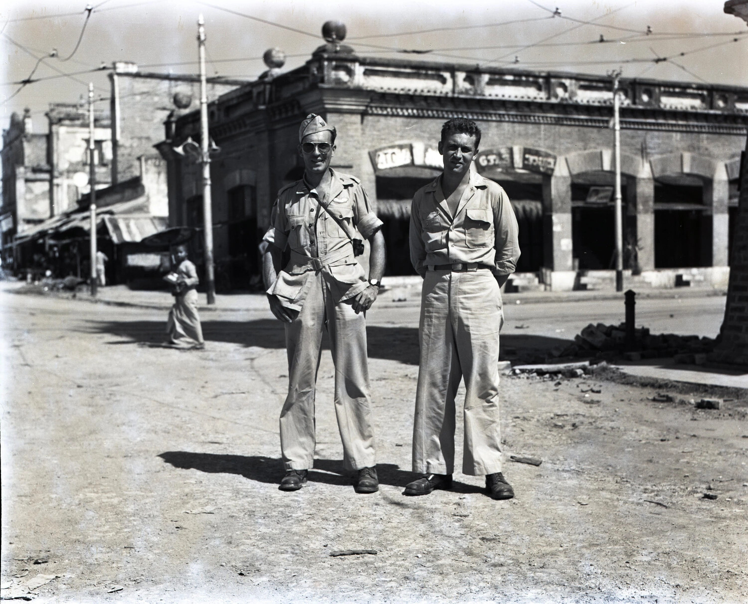 American Servicemen at a Bomb-Damaged Street Corner in Mandalay, Burma, 1945