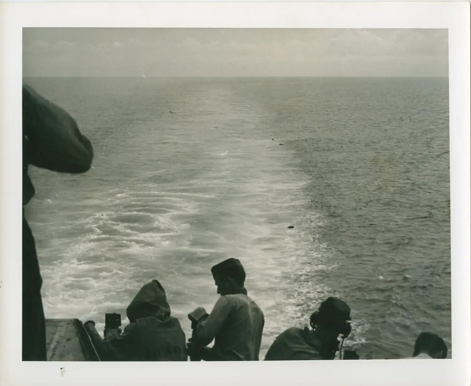 Stern View from USS Petrof Bay (CVE-80) with Sailors Observing Wake, WWII Pacific Theater