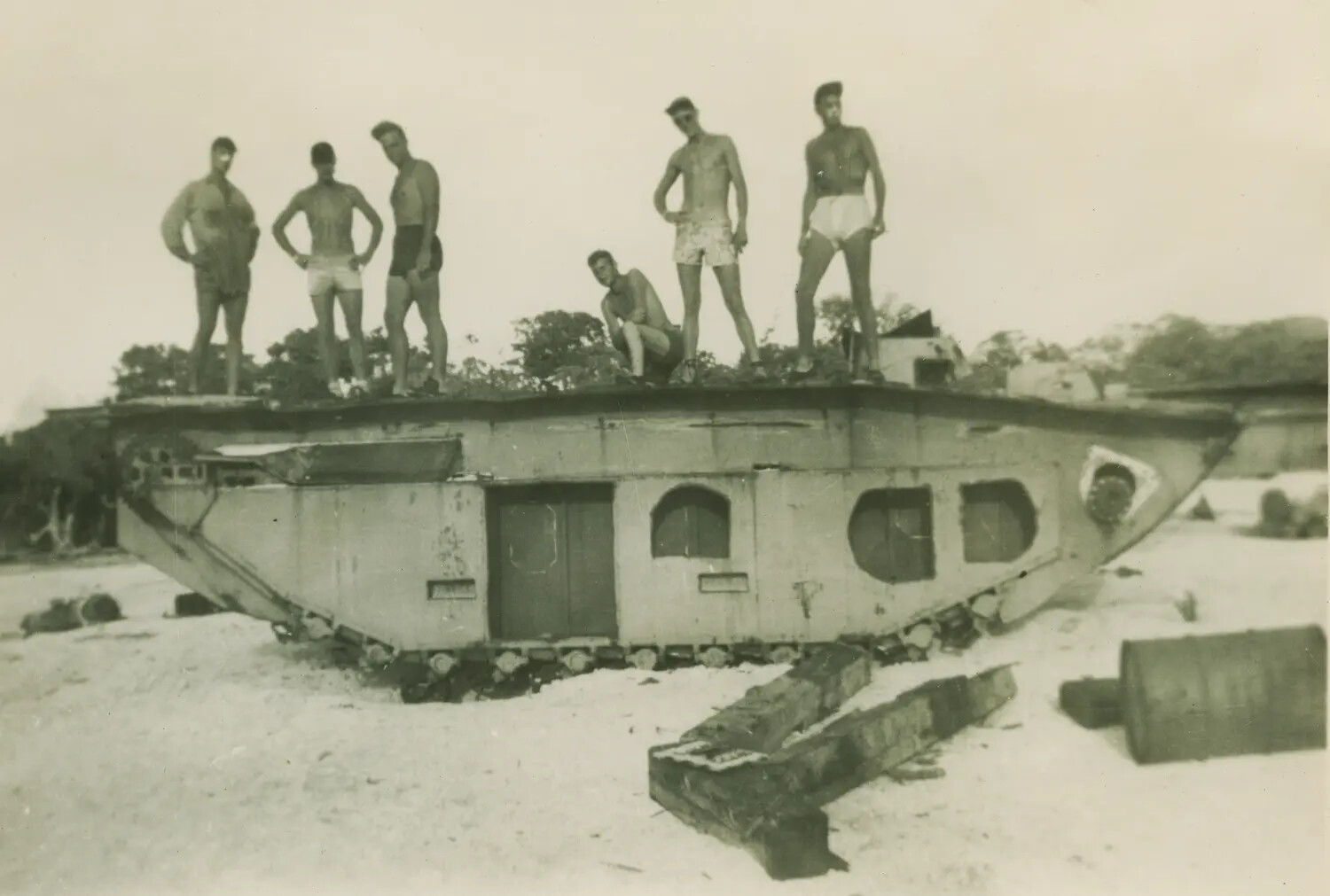 U.S. Servicemen Posing on Disabled Landing Vehicle Tracked (LVT) on Pacific Beach, WWII