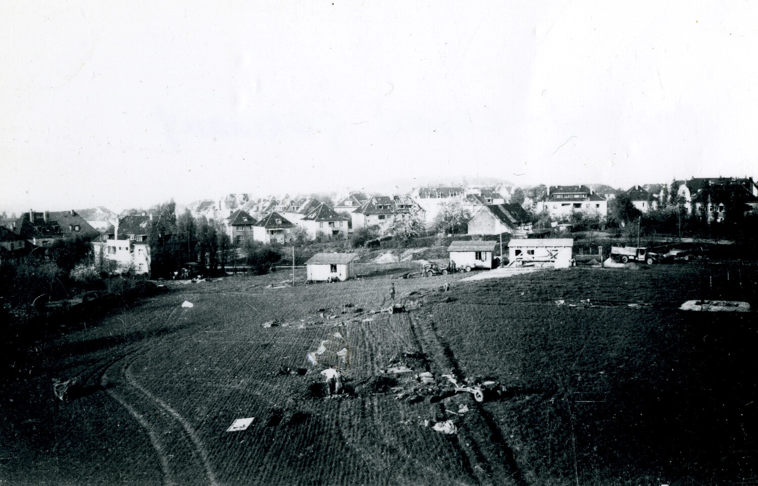Aircraft/Glider Wreckage in a Plowed Field Near a European Village