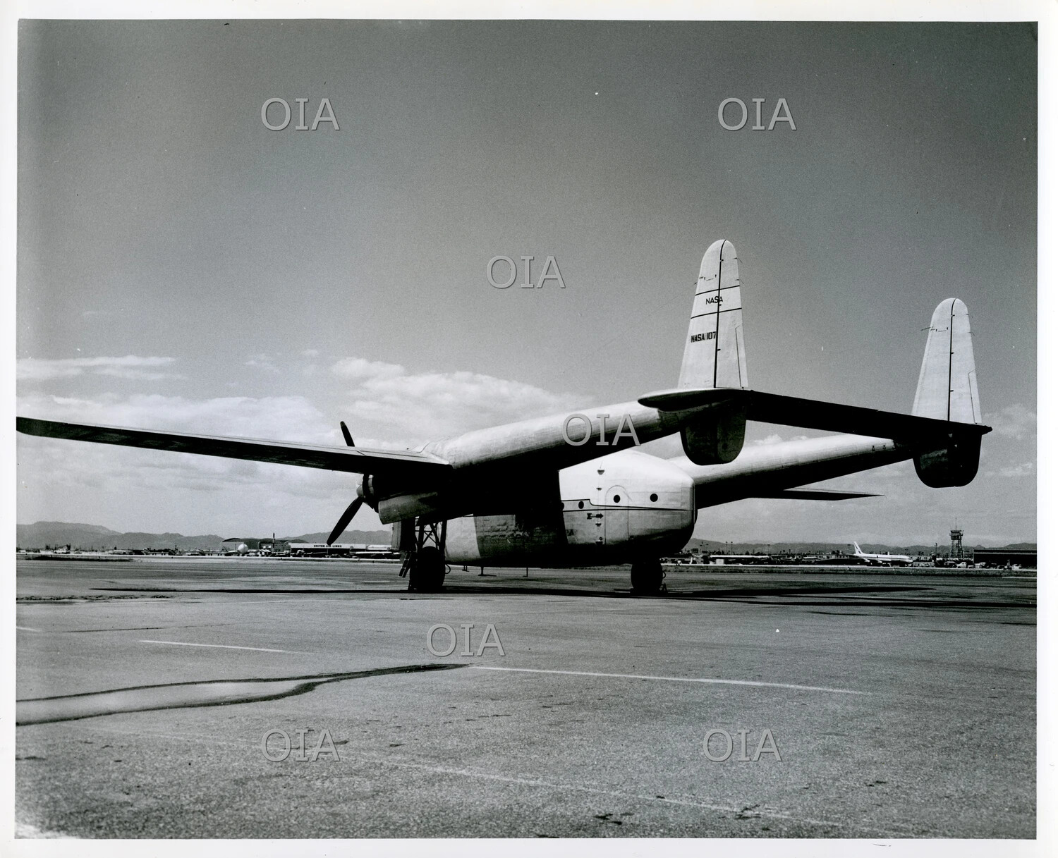 NASA Fairchild C-119/C-82 Twin-Boom Cargo Aircraft, Rear Three-Quarter View, Tail Number NASA 107