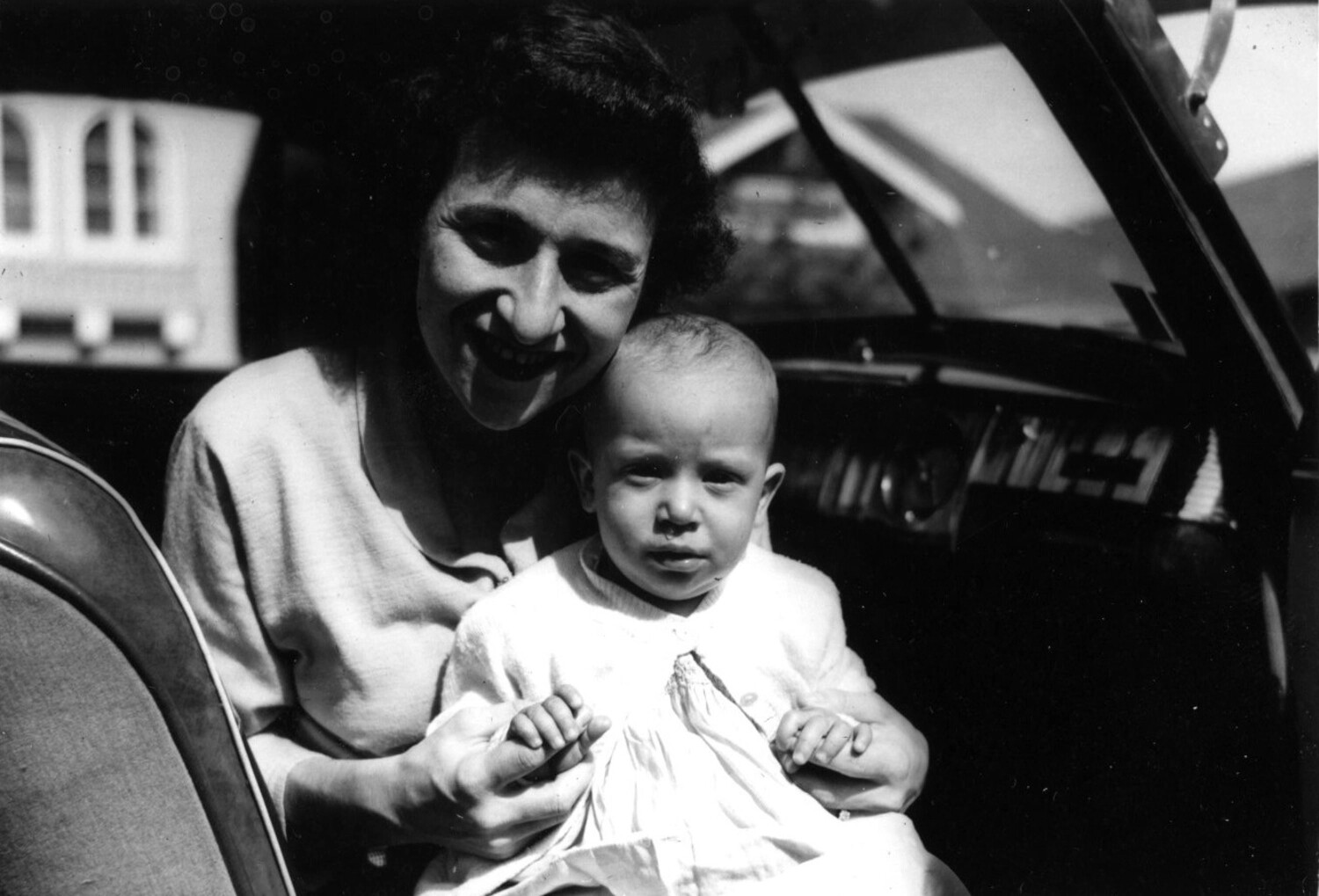 Woman and Infant Seated in Convertible Automobile, Family Snapshot, c. 1950s (Bancroft Collection)