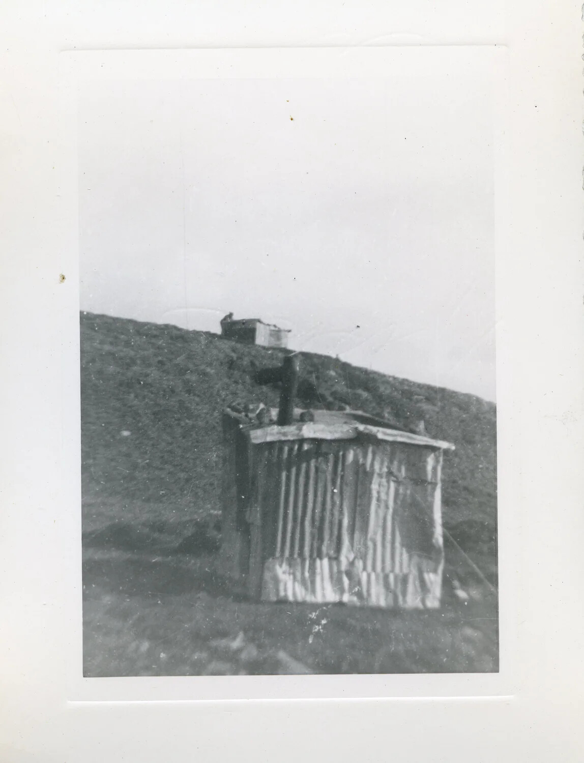 Corrugated Metal Field Shelter on Aleutian Hillside, World War II