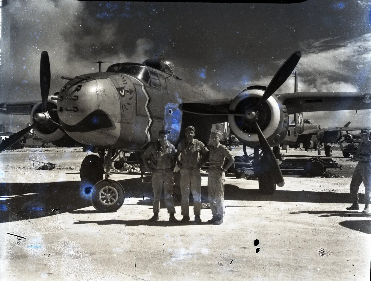 Three Airmen with a 345th Bombardment Group B-25 Mitchell Strafer, Ie Shima