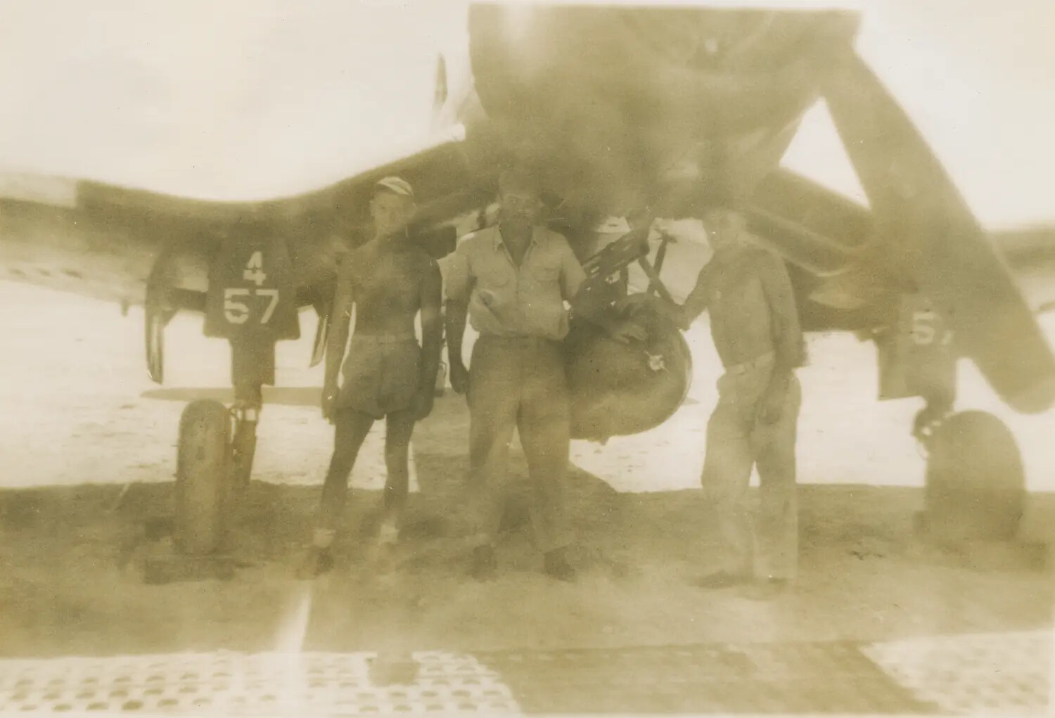 Ground Crew or Aircrew Posing Beside a Fighter Aircraft, Pacific Theater, WWII