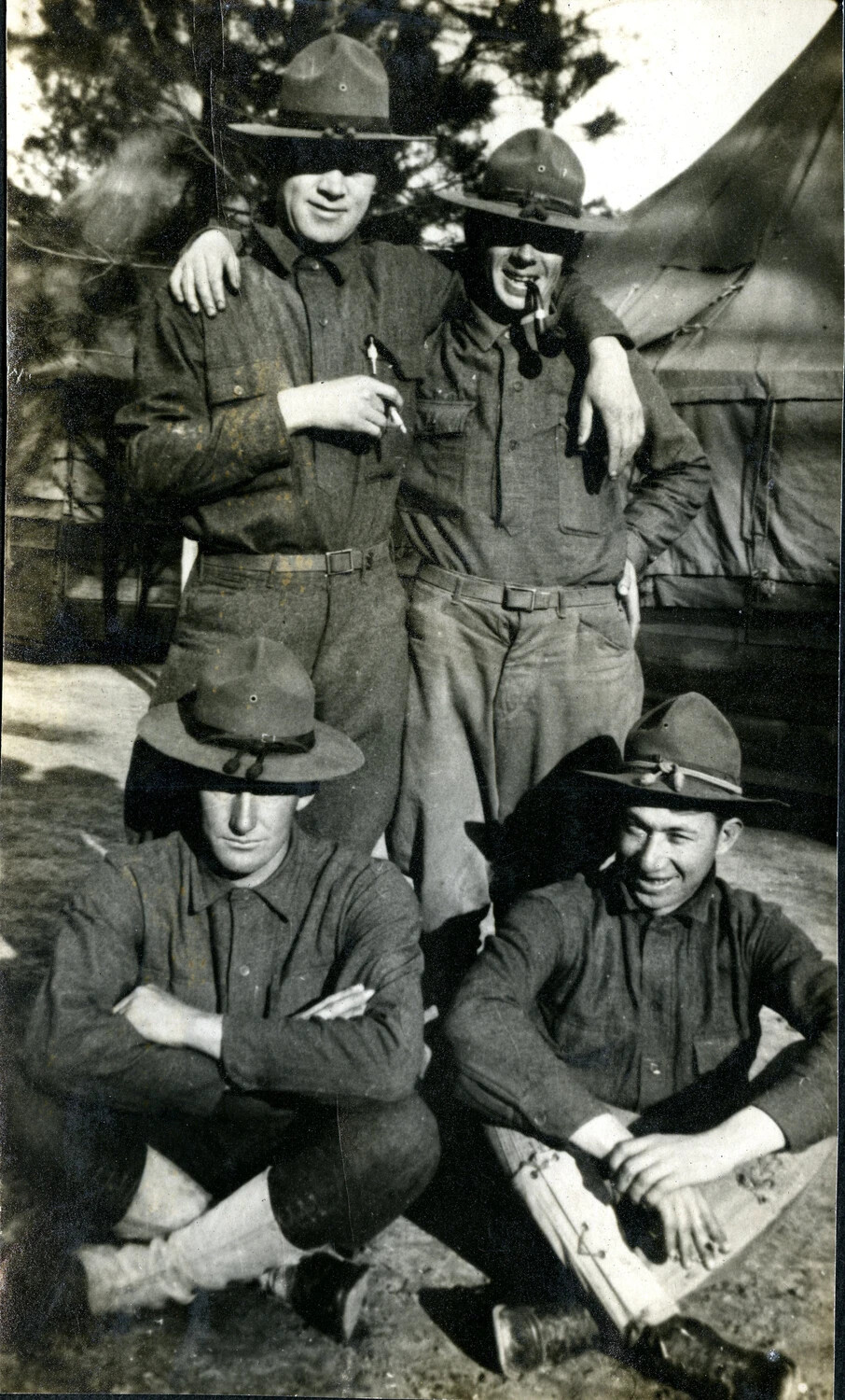 Four Soldiers Posing Outside Tents at Training Camp, WWI Era