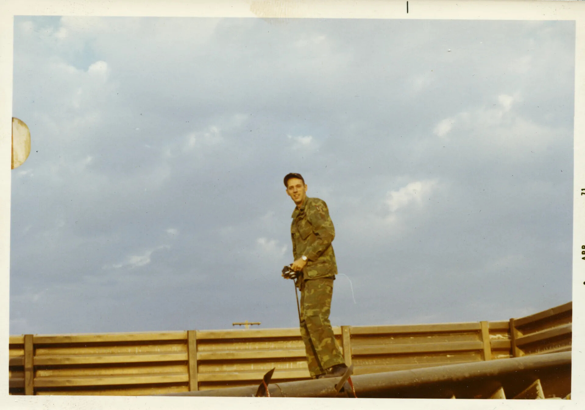 Serviceman Atop Bunker Revetment, NKP Air Base, Thailand, April 1971