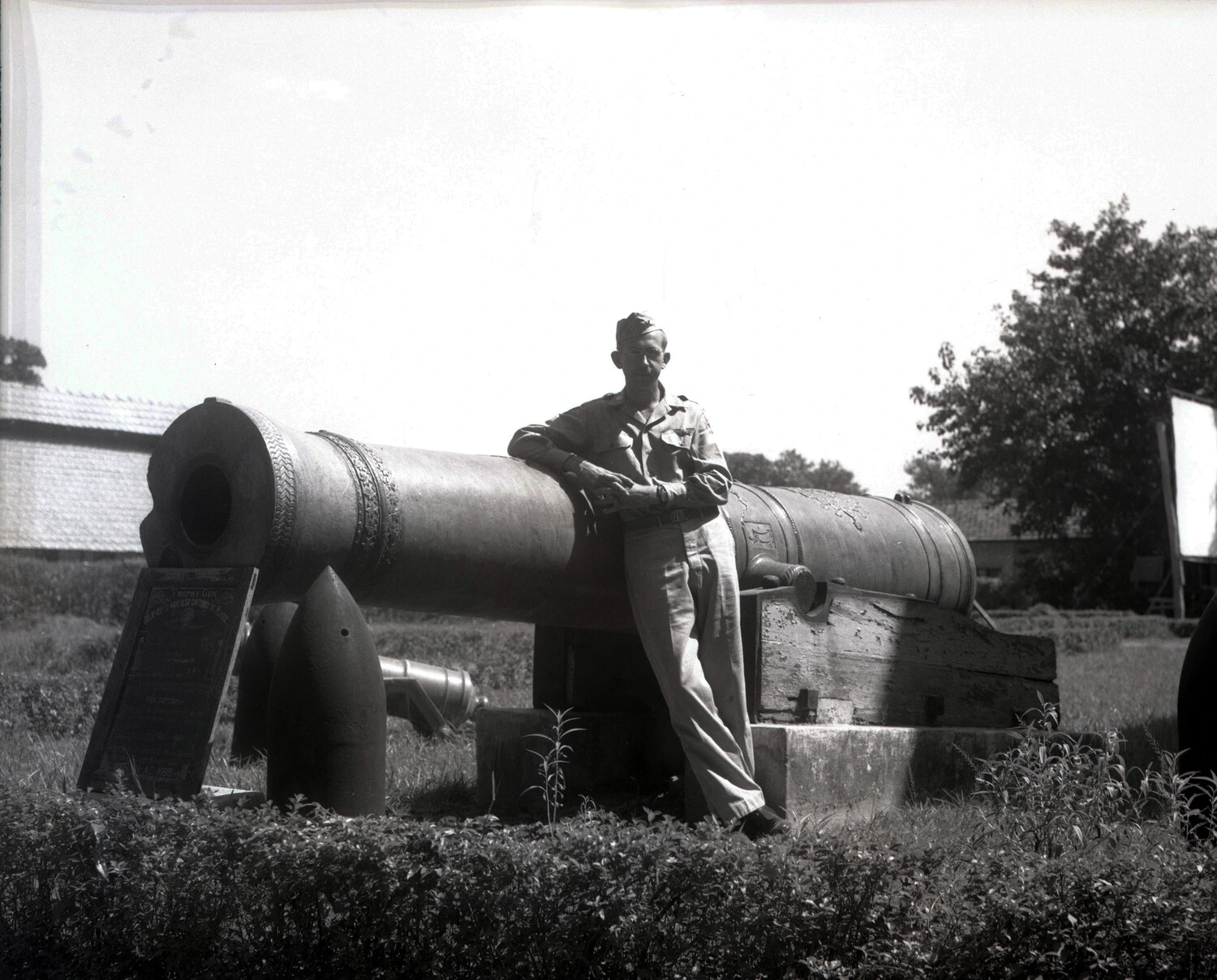 U.S. Airman Posing with Antique Trophy Cannon, China-Burma Theater, WWII
