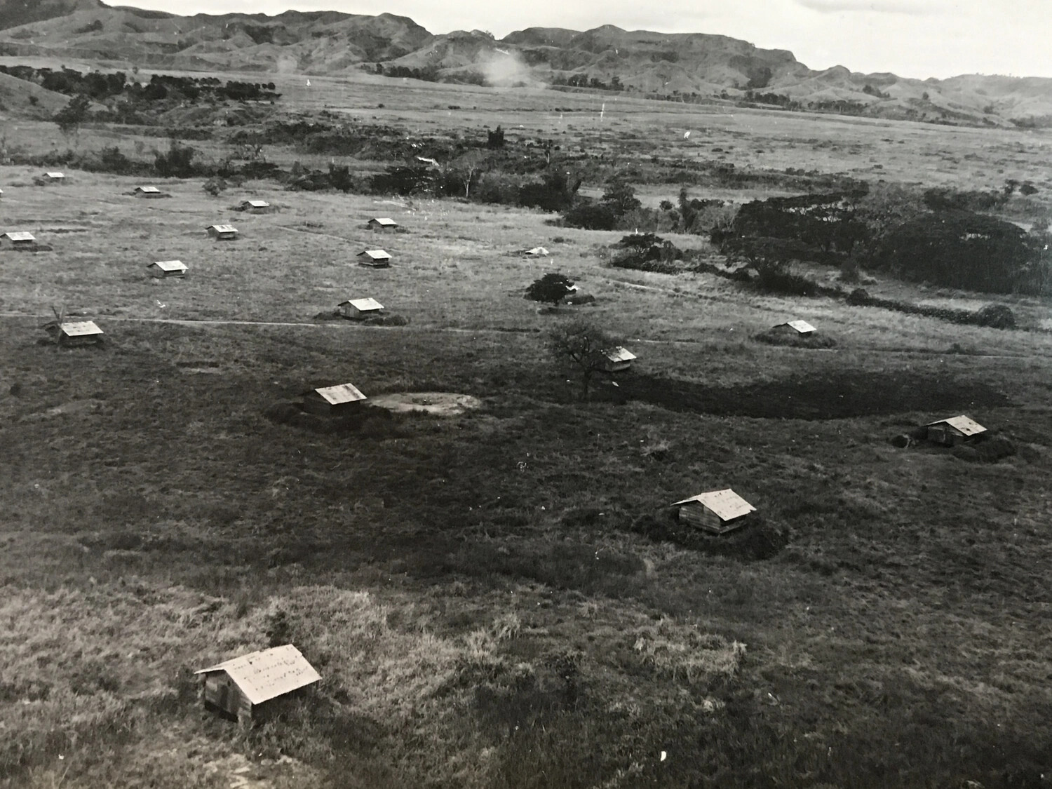 Aerial View of Dispersed Storage Bunkers or Dugouts Across an Open Valley