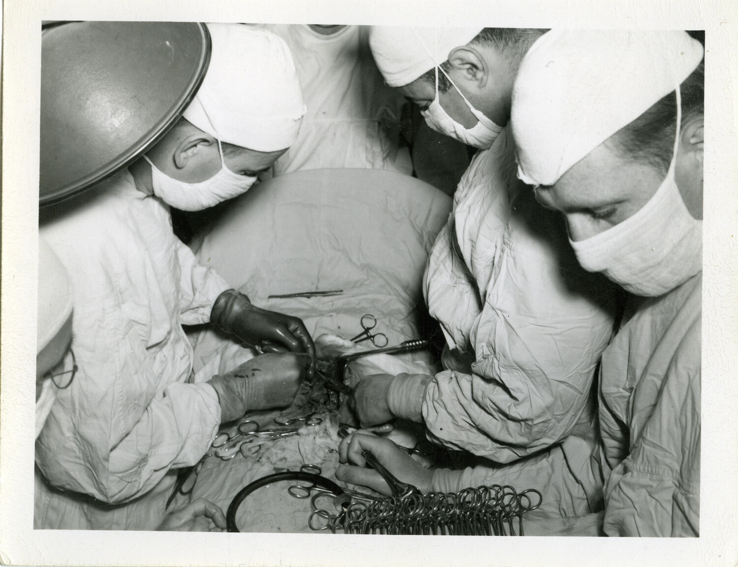 Surgical Team Performing Operation in Field Hospital Operating Area