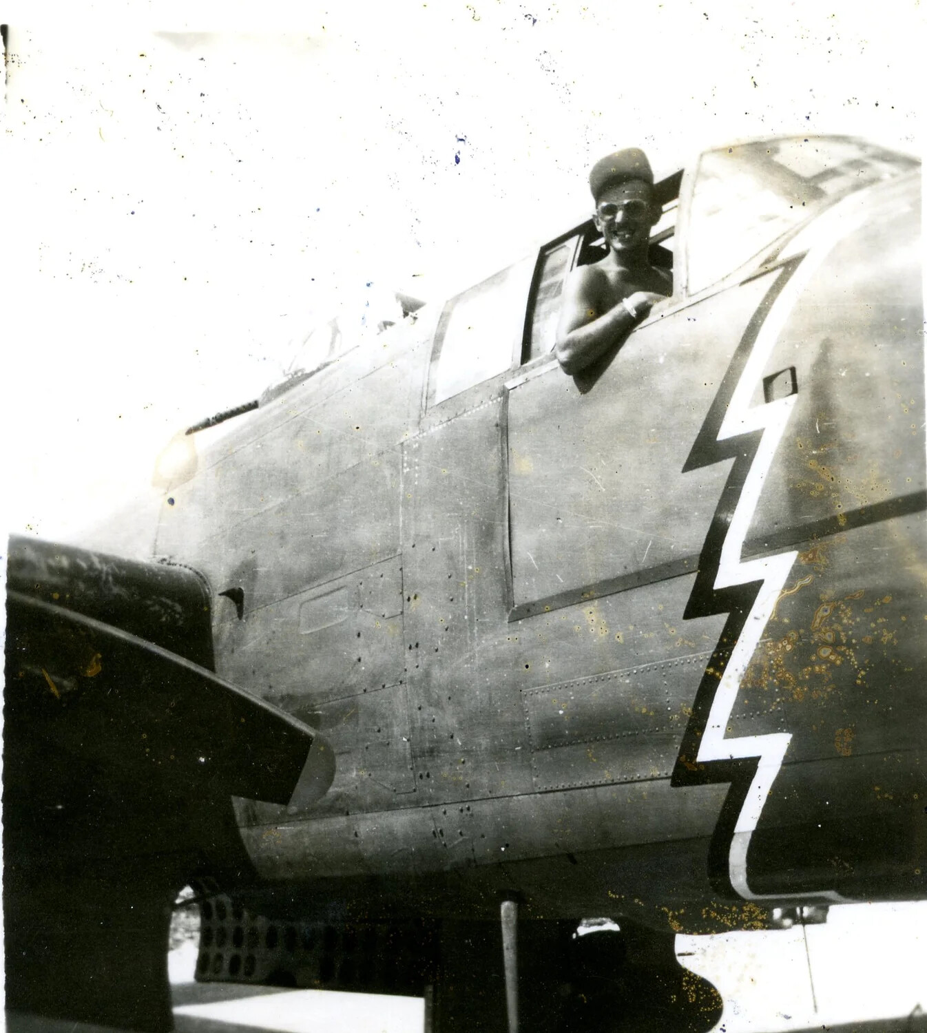 USAAF Airman in B-25 Mitchell Cockpit Window with Lightning Bolt Nose Marking, Pacific Theater, WWII