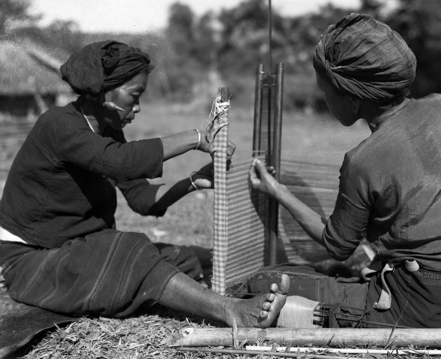 Burmese Women Weaving on a Backstrap Loom, WWII China-Burma-India Theater Collection